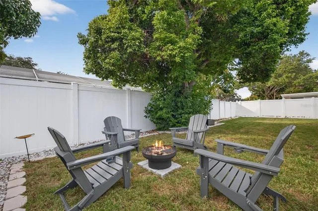 a view of a patio with two chairs and a table