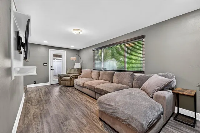 a living room with furniture and a large window