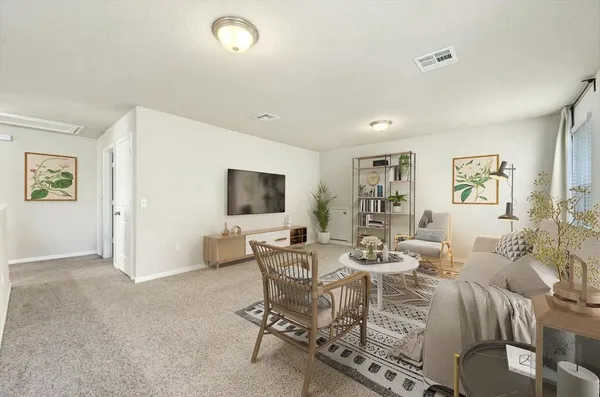 a dining room with furniture and window