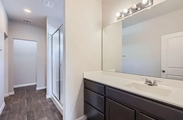 a bathroom with a sink and a mirror