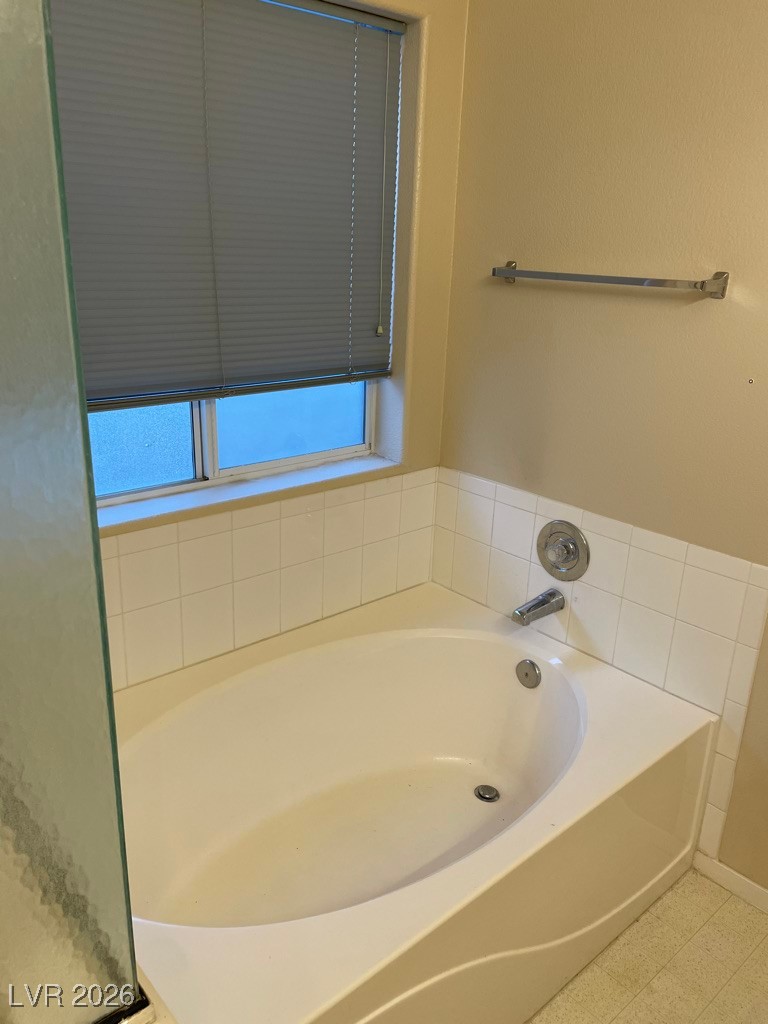 2115 Hidden Ranch Terrace Henderson, NV 89052 - Photo 11 of 30 Bathroom featuring a garden tub and tile patterned floors
