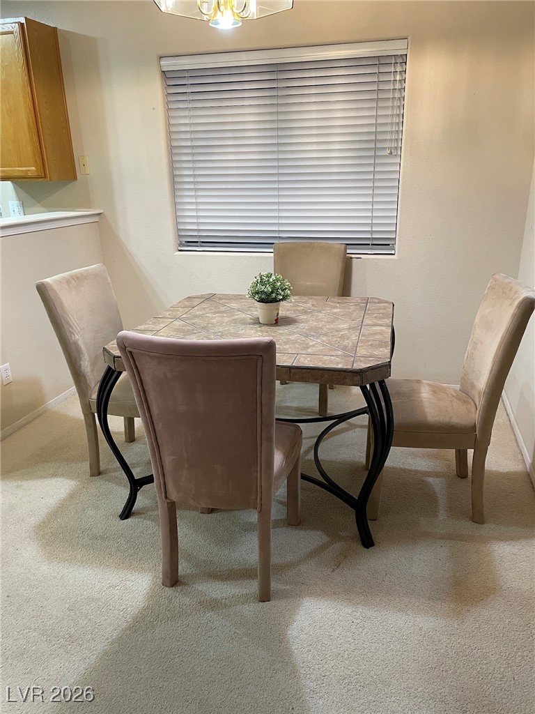 2115 Hidden Ranch Terrace Henderson, NV 89052 - Photo 15 of 30 Dining space with light carpet and suspended lighting