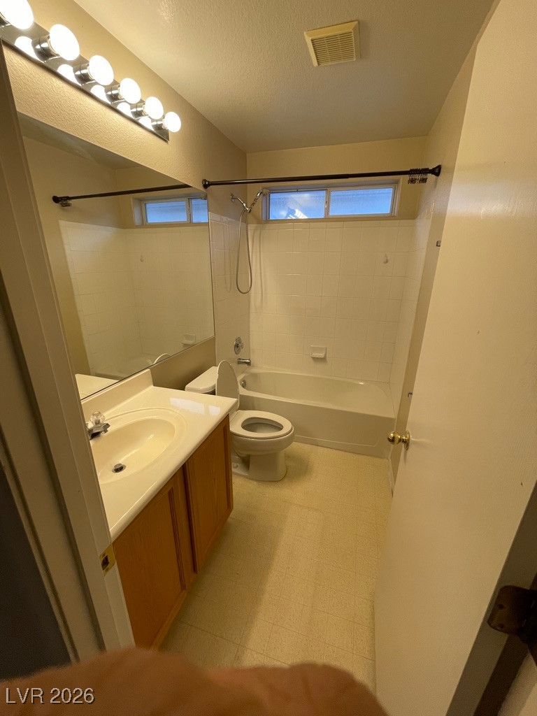 2115 Hidden Ranch Terrace Henderson, NV 89052 - Photo 17 of 30 Full bath featuring shower / bathtub combination, vanity, a textured ceiling, and light floors