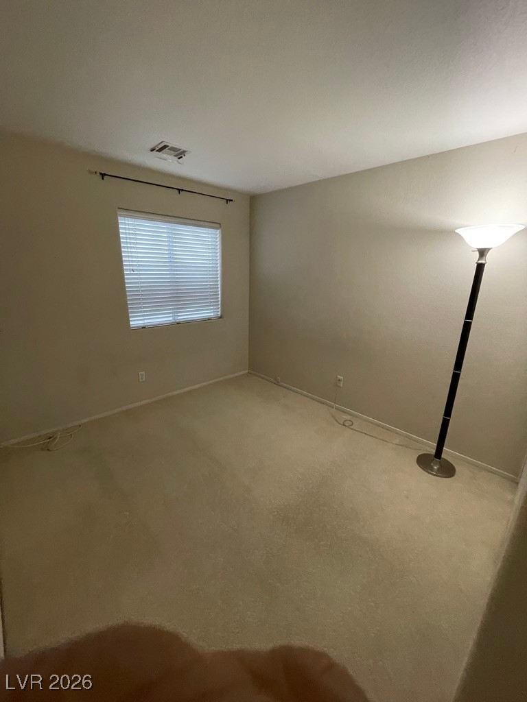 2115 Hidden Ranch Terrace Henderson, NV 89052 - Photo 18 of 30 Spare room featuring carpet and baseboards