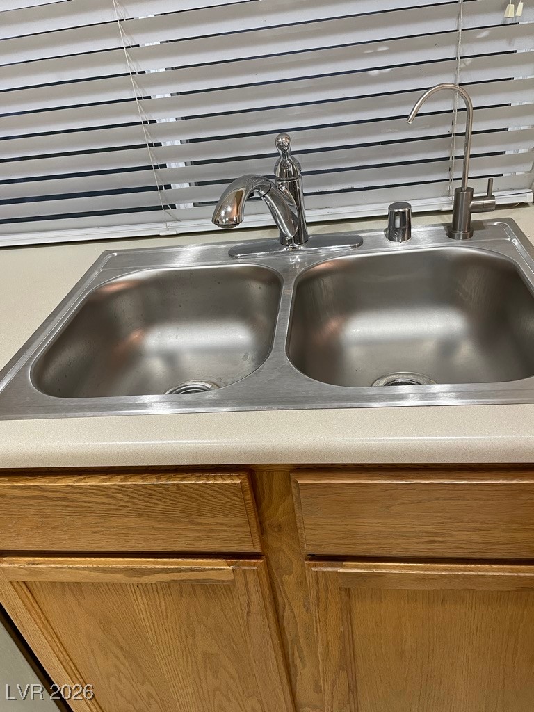 2115 Hidden Ranch Terrace Henderson, NV 89052 - Photo 22 of 30 Kitchen view of wood finish cabinetry and light countertops