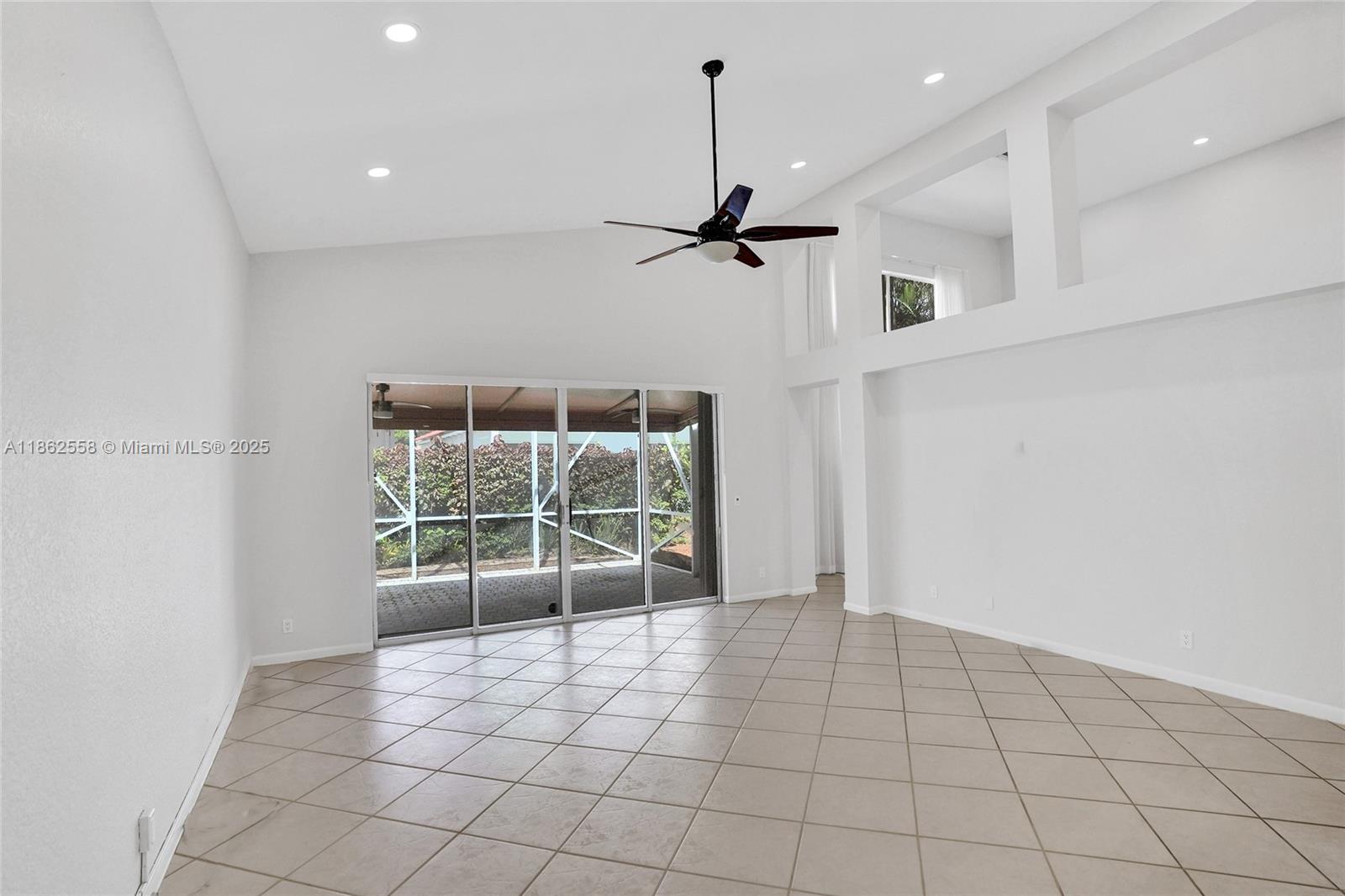 6450 Brava Way Boca Raton, FL 33433 - Photo 16 of 80 a view of an empty room with a window