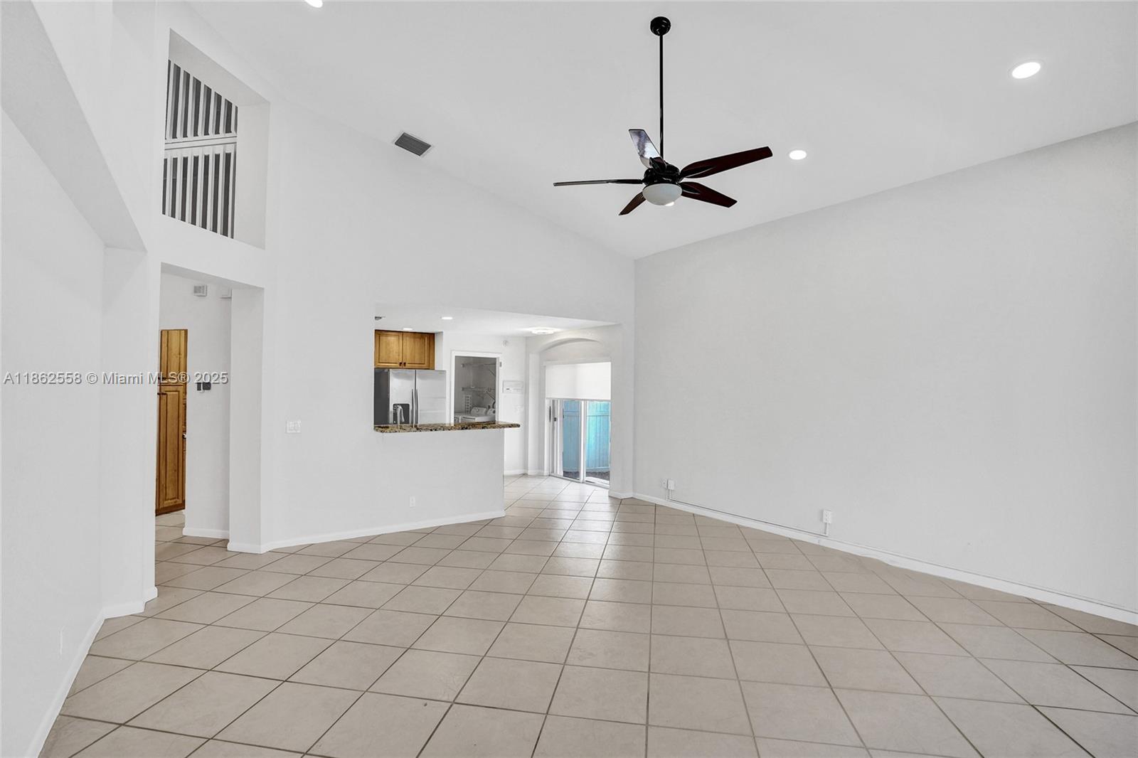 6450 Brava Way Boca Raton, FL 33433 - Photo 18 of 80 a view of an empty room with a window