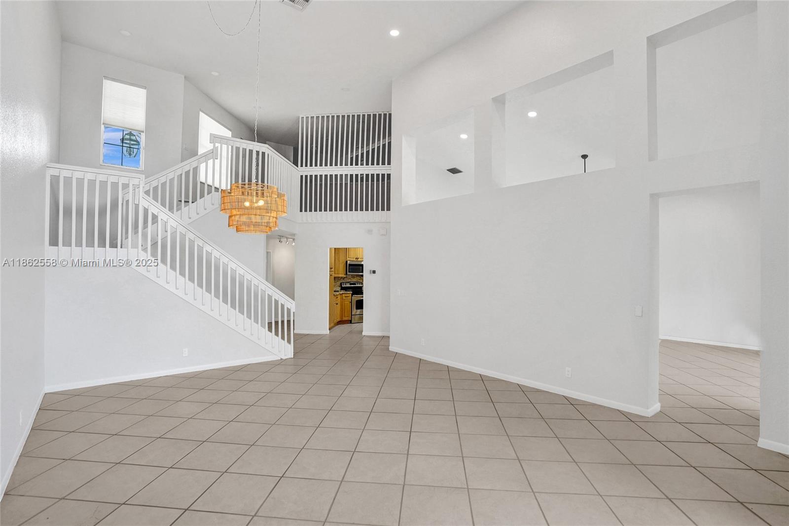 6450 Brava Way Boca Raton, FL 33433 - Photo 25 of 80 a view of an entryway with wooden floor