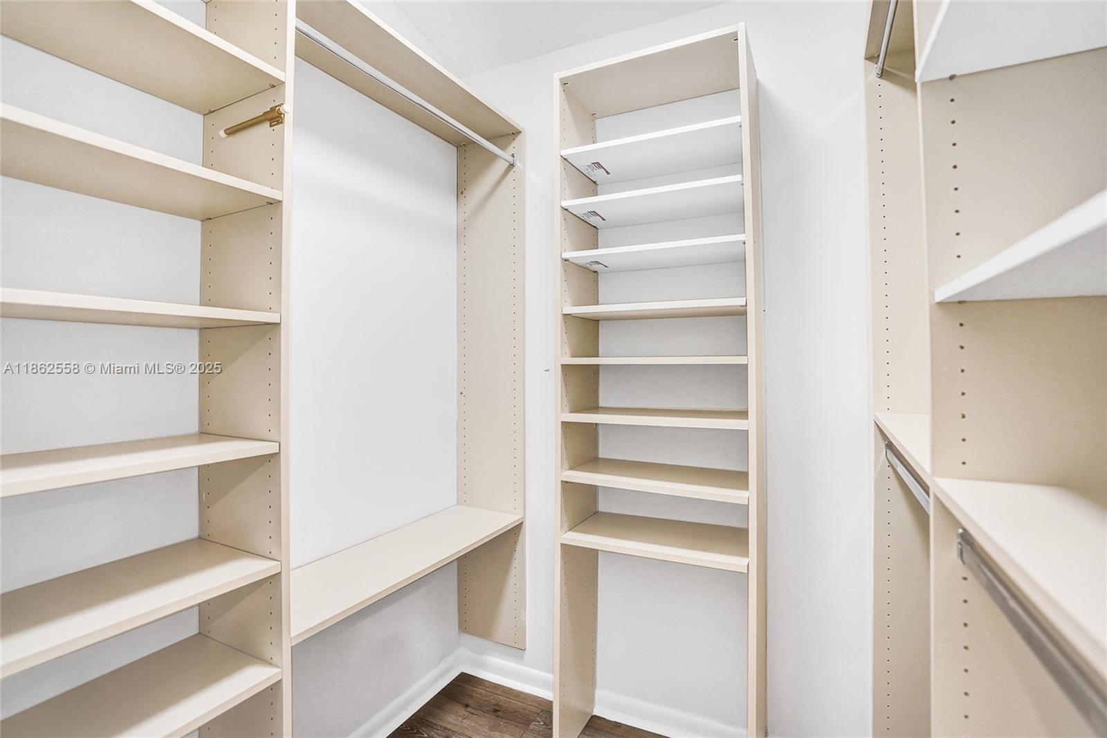 6450 Brava Way Boca Raton, FL 33433 - Photo 38 of 80 a view of walk in closet with empty racks