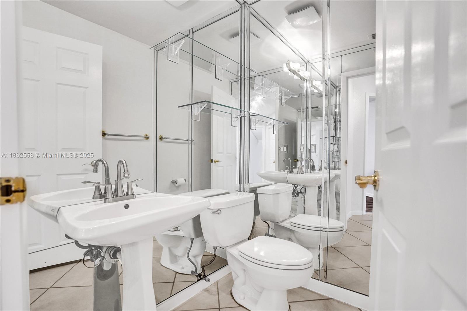 6450 Brava Way Boca Raton, FL 33433 - Photo 42 of 80 a bathroom with a sink toilet and shower