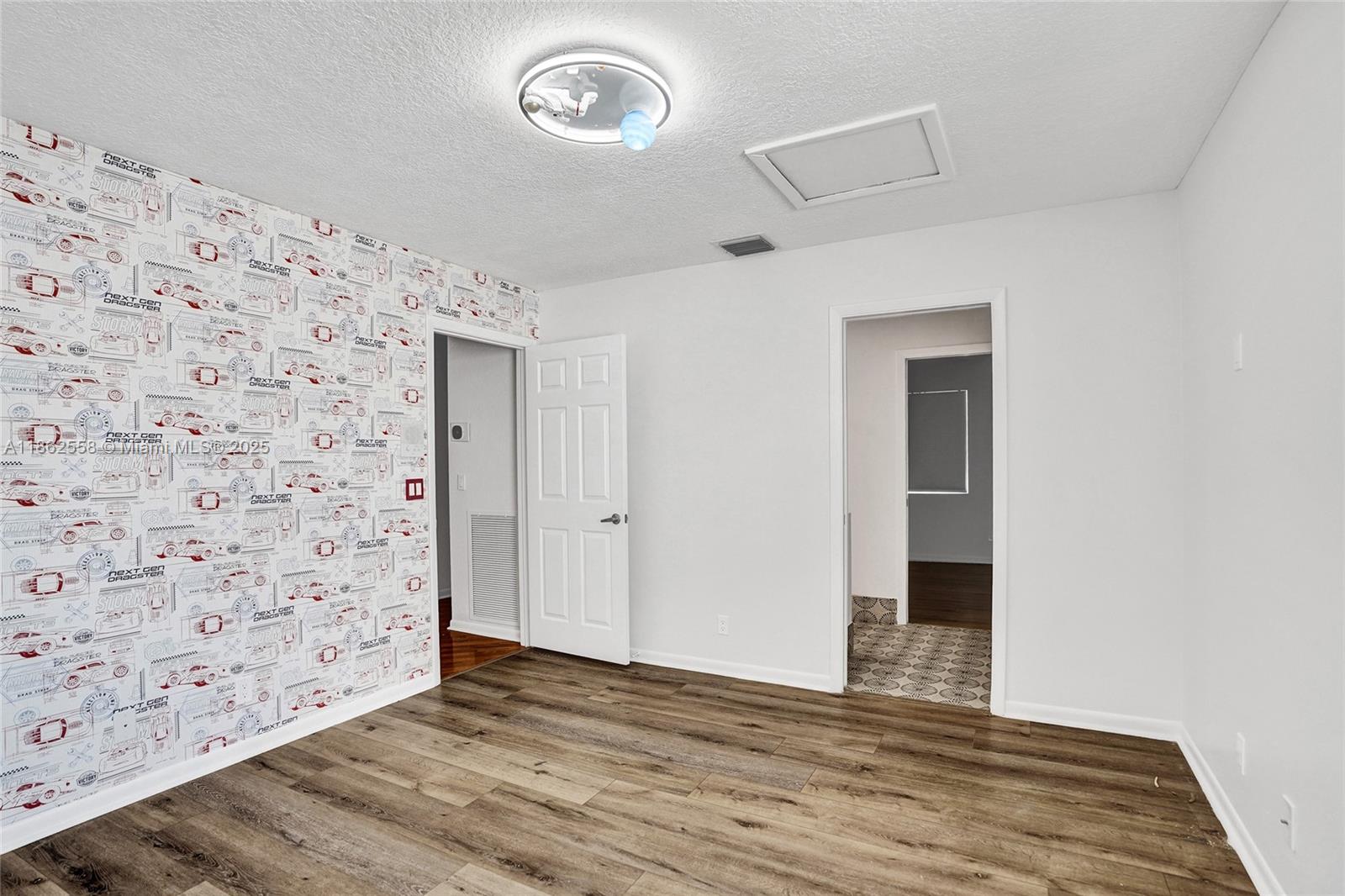 6450 Brava Way Boca Raton, FL 33433 - Photo 47 of 80 a view of a livingroom with wooden floor and closet