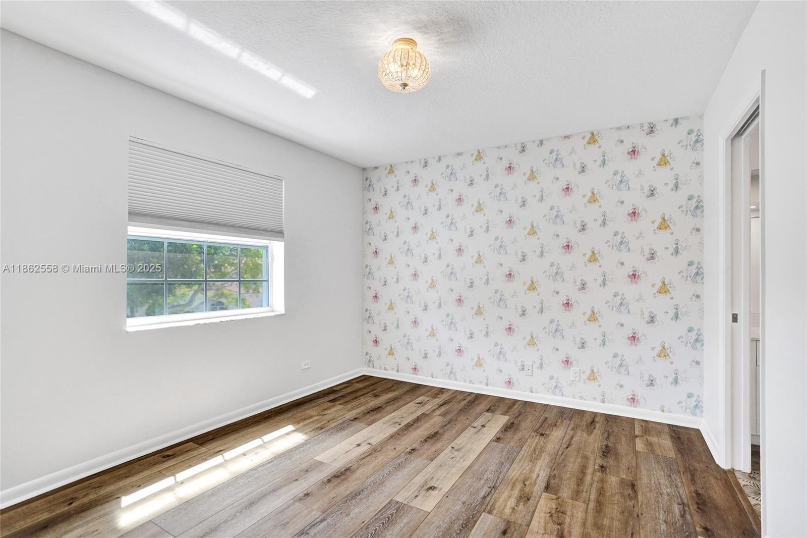 6450 Brava Way Boca Raton, FL 33433 - Photo 50 of 80 an empty room with wooden floor and windows