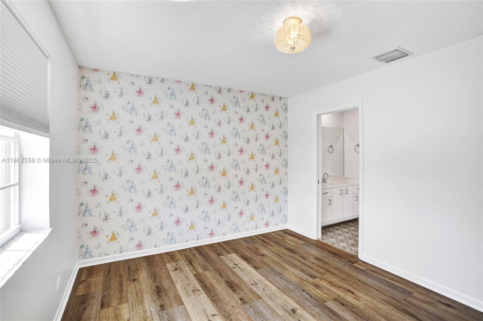 6450 Brava Way Boca Raton, FL 33433 - Photo 51 of 80 a view of a hallway with wooden floor and a cabinet