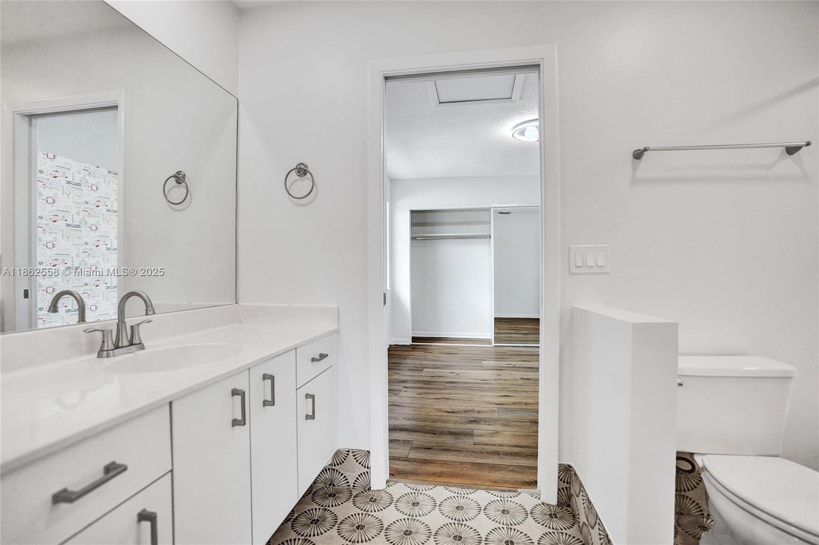 6450 Brava Way Boca Raton, FL 33433 - Photo 54 of 80 a bathroom with a sink and a mirror