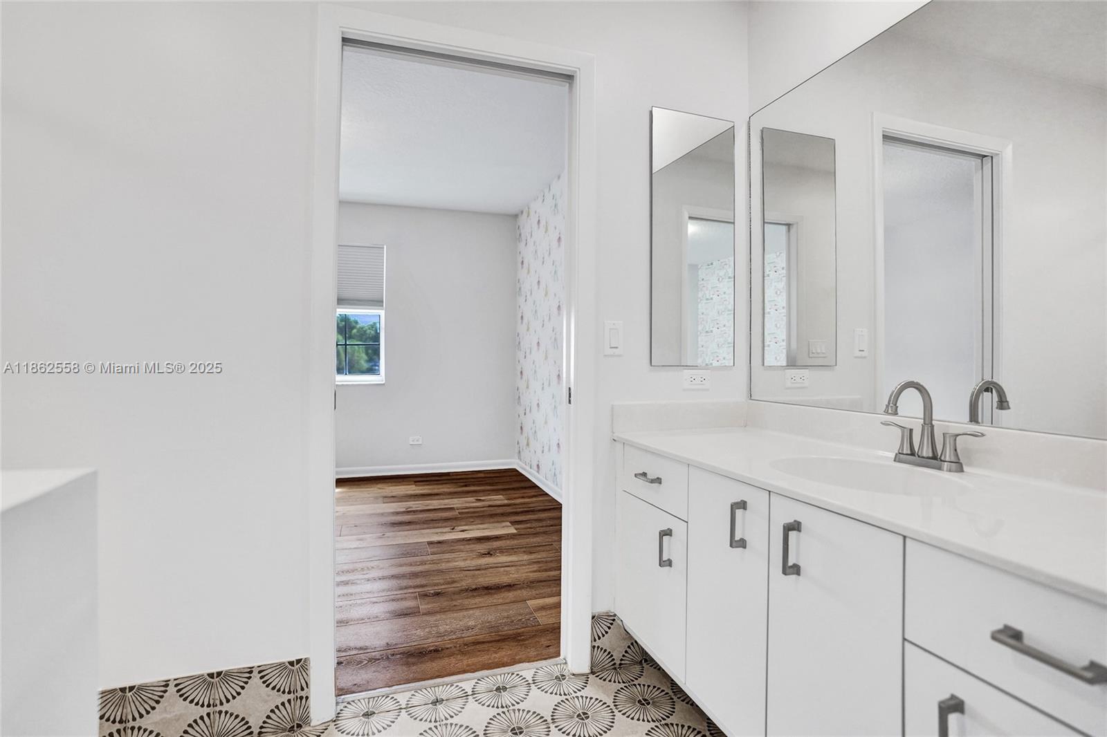 6450 Brava Way Boca Raton, FL 33433 - Photo 55 of 80 a bathroom with a sink and a mirror