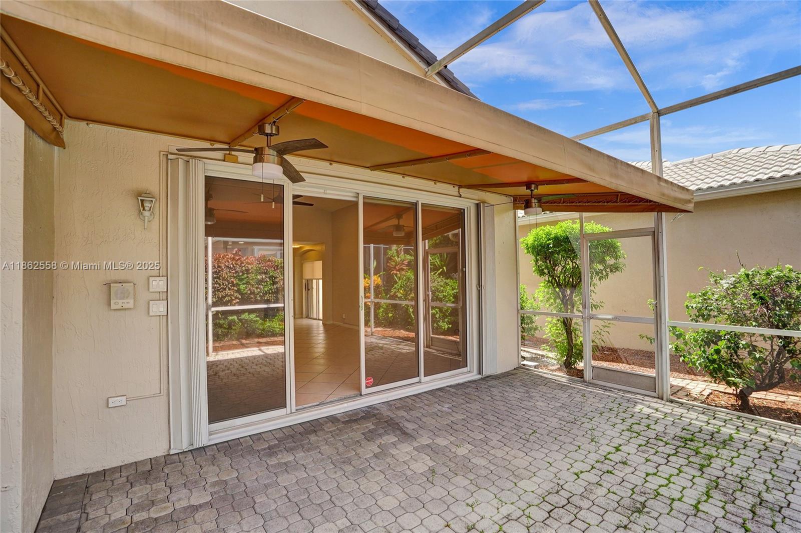 6450 Brava Way Boca Raton, FL 33433 - Photo 61 of 80 a view of a house with a big yard and potted plants