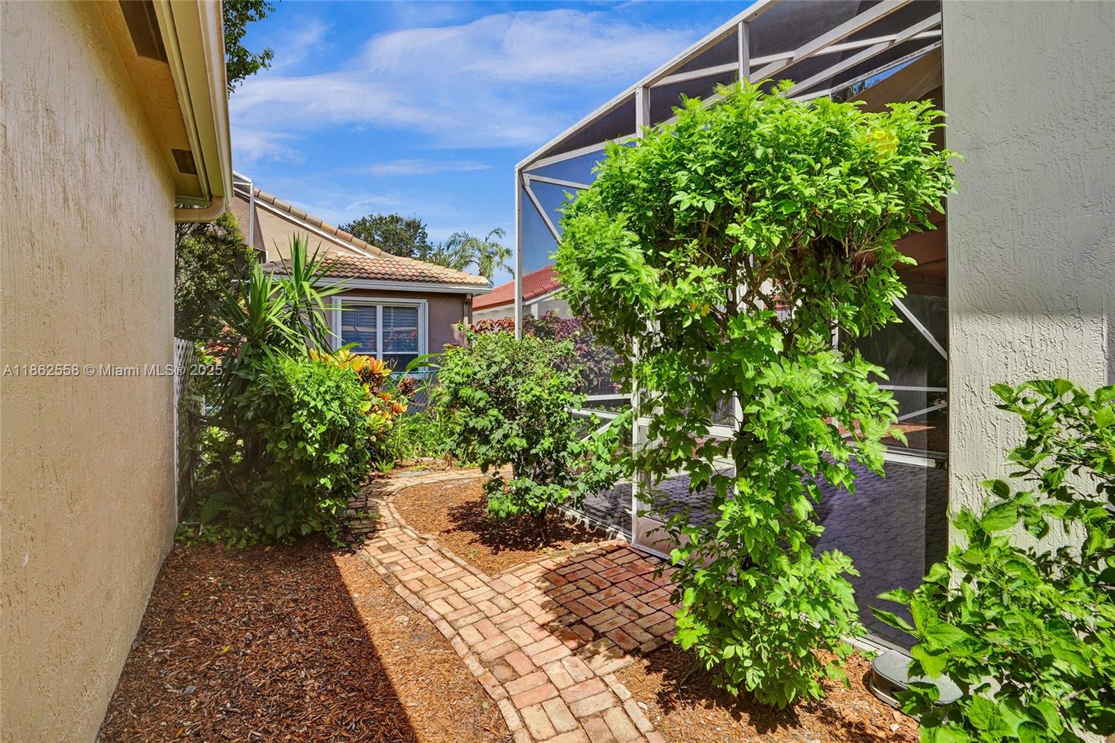 6450 Brava Way Boca Raton, FL 33433 - Photo 63 of 80 a view of a garden with pathway