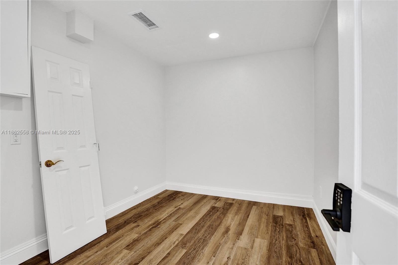 6450 Brava Way Boca Raton, FL 33433 - Photo 69 of 80 a view of a room with wooden floor and bathroom