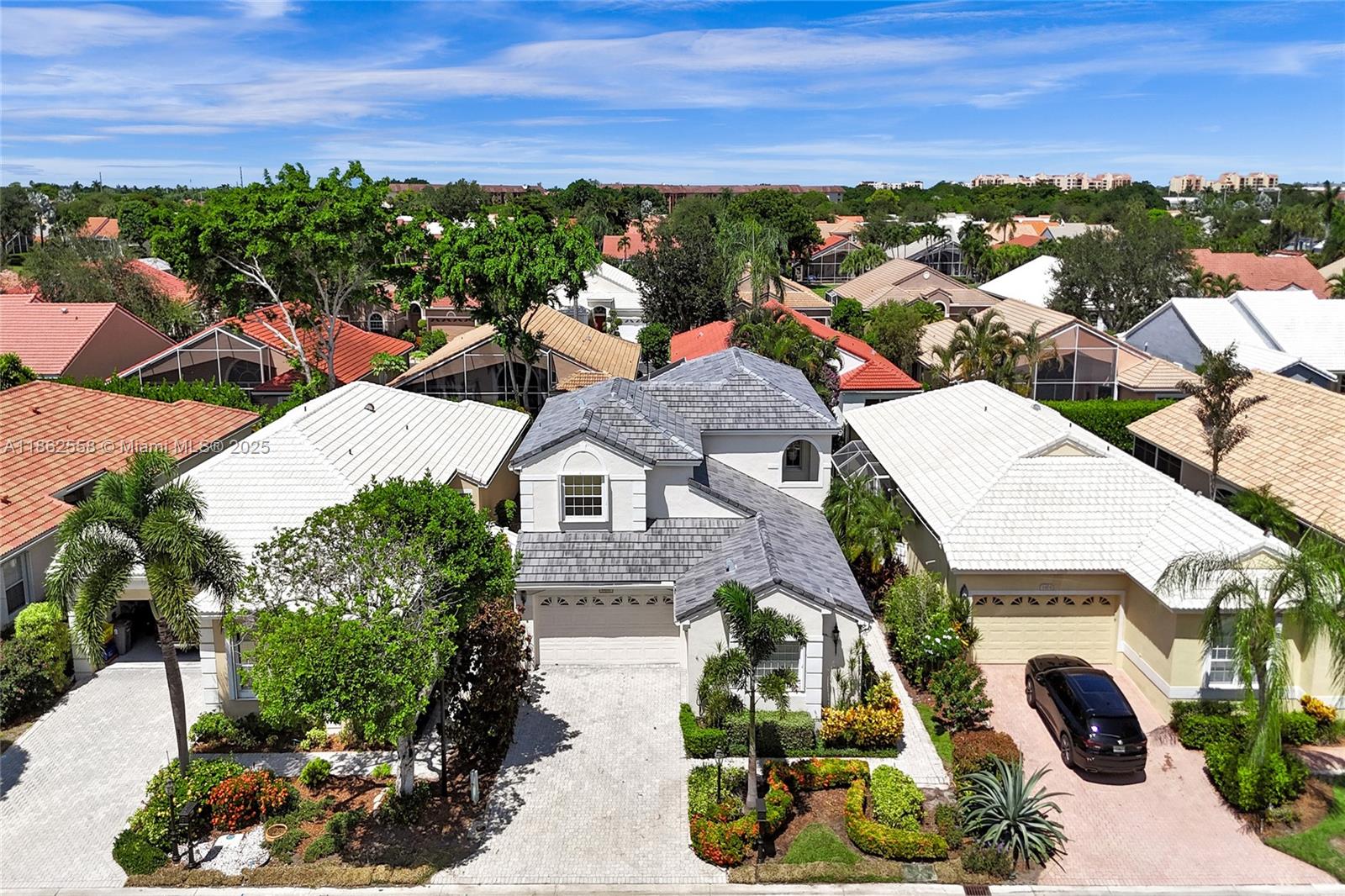 6450 Brava Way Boca Raton, FL 33433 - Photo 76 of 80 an aerial view of a house with a garden