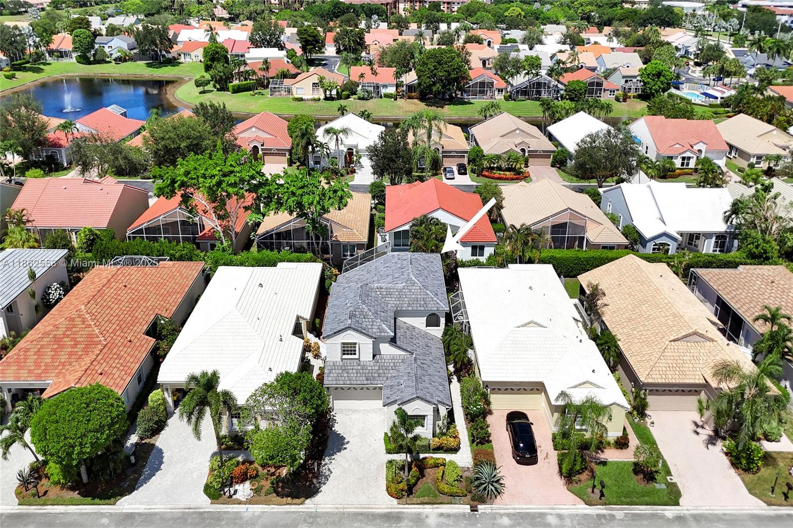 6450 Brava Way Boca Raton, FL 33433 - Photo 77 of 80 an aerial view of residential houses with outdoor space and parking