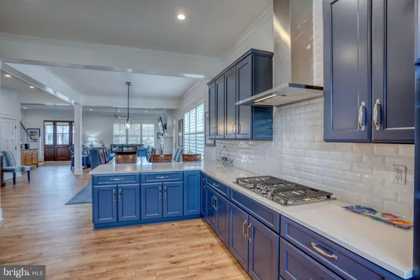 a spacious bathroom with a granite countertop sink a mirror and a shower