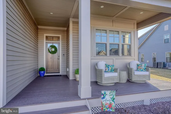 a kitchen with stainless steel appliances granite countertop a stove a sink dishwasher and cabinets with wooden floor