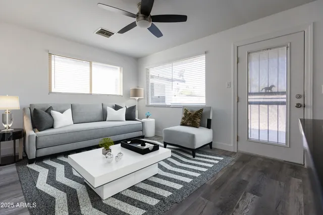 a living room with furniture and a window
