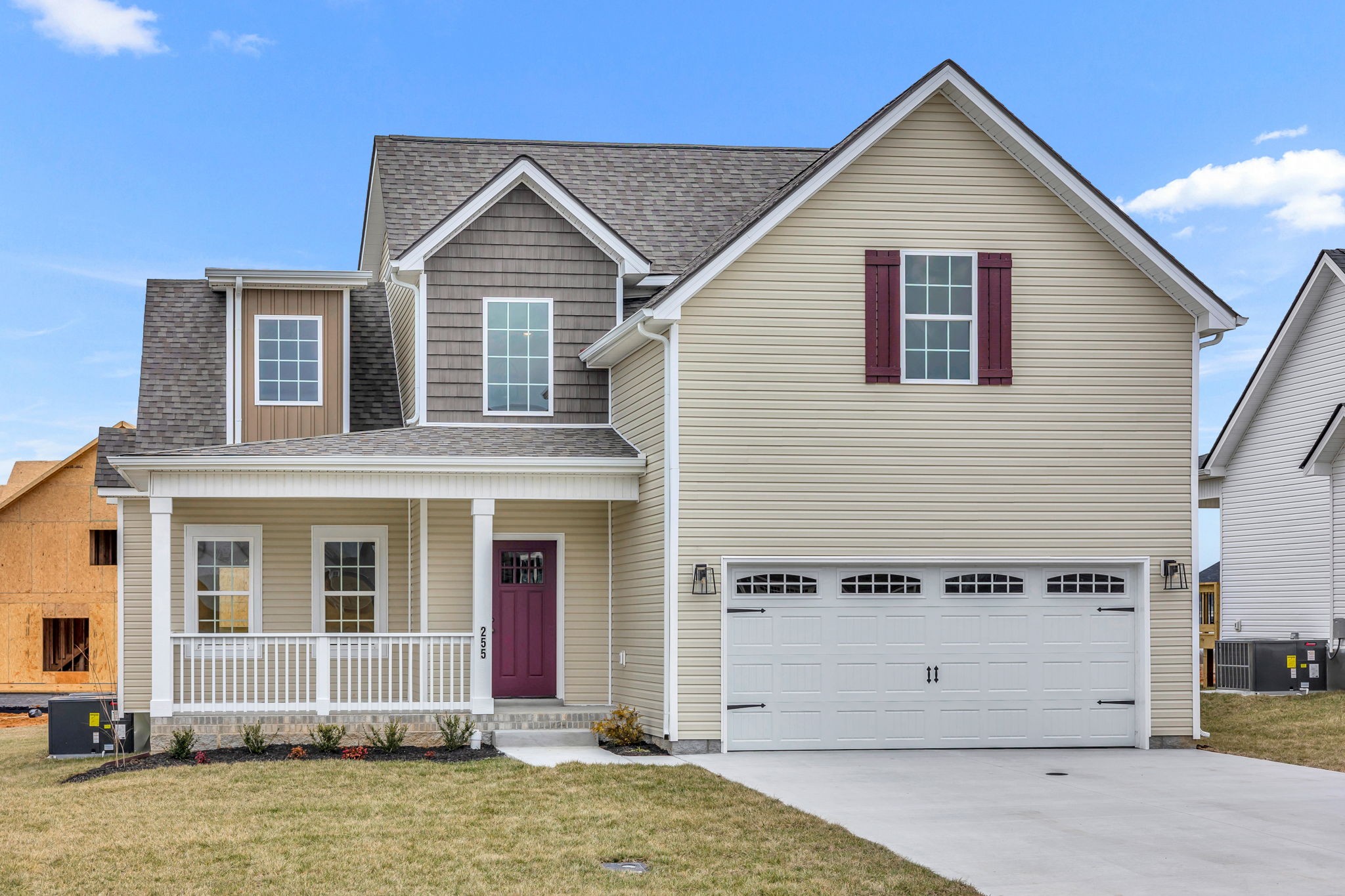 a view of a house with wooden fence