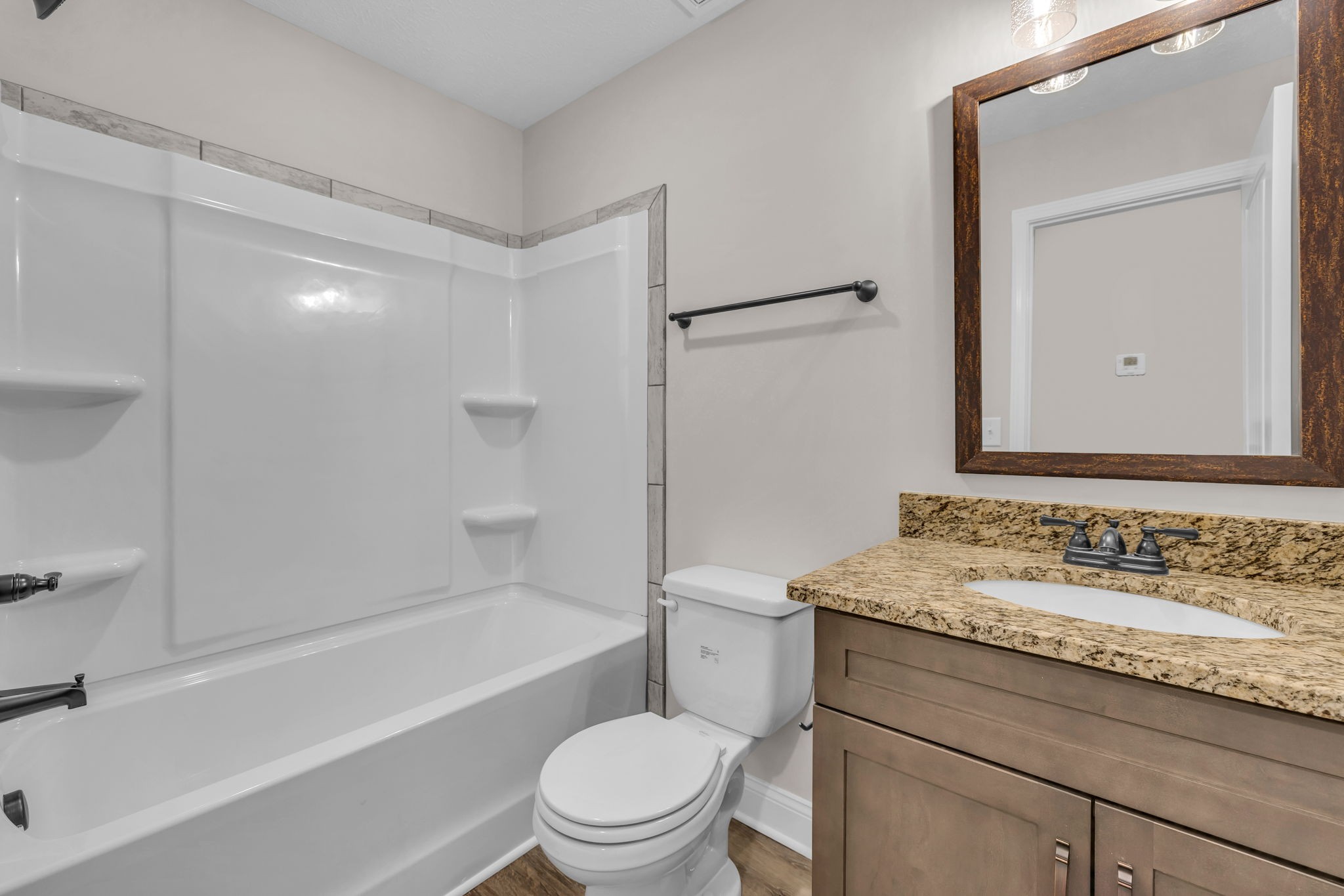 150 Cherry Fields Clarksville, TN 37042 - Photo 26 of 30 a bathroom with a granite countertop bathtub shower sink vanity and toilet