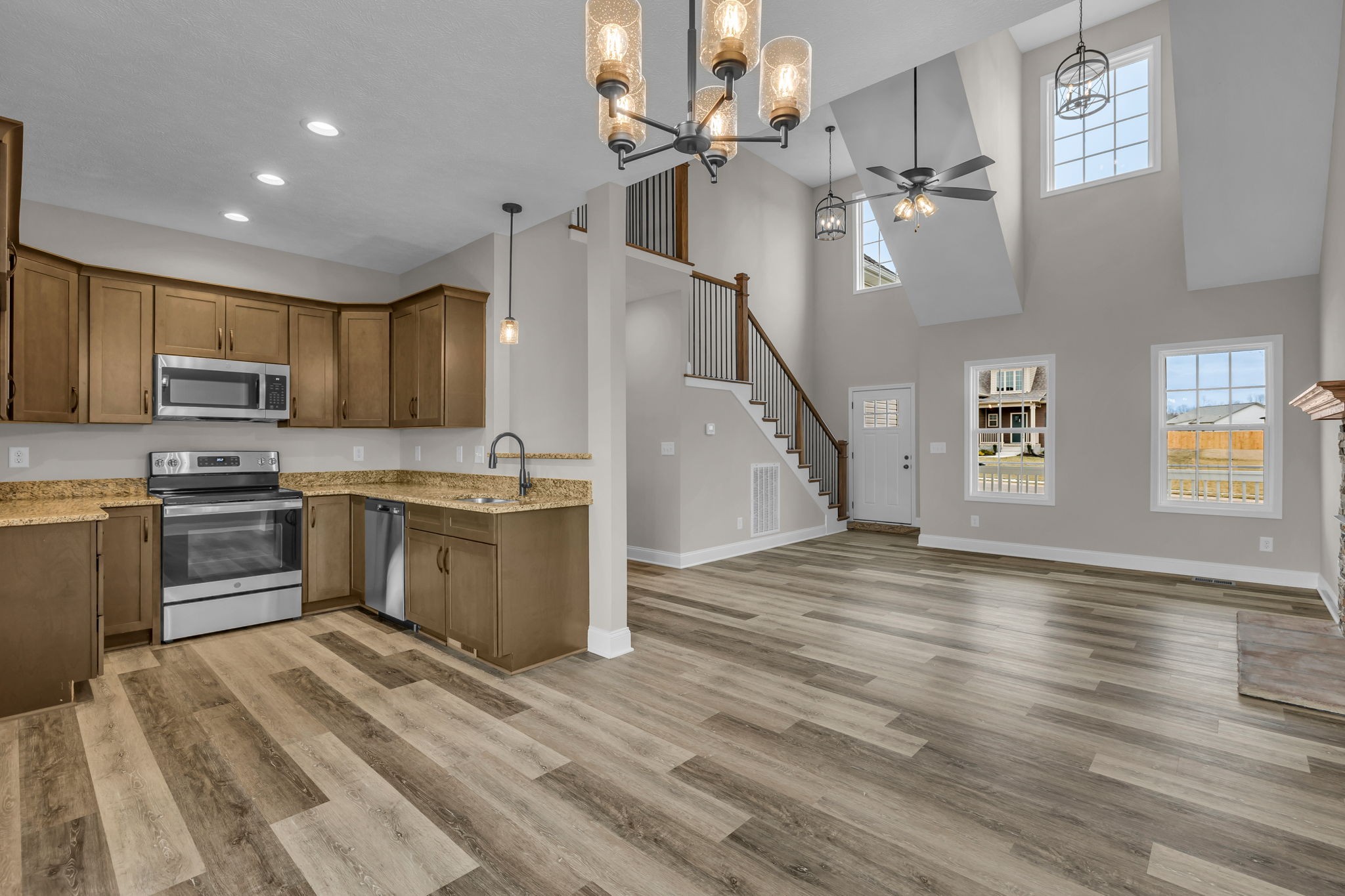 150 Cherry Fields Clarksville, TN 37042 - Photo 8 of 30 a kitchen with granite countertop a sink cabinets stainless steel appliances and a counter top space