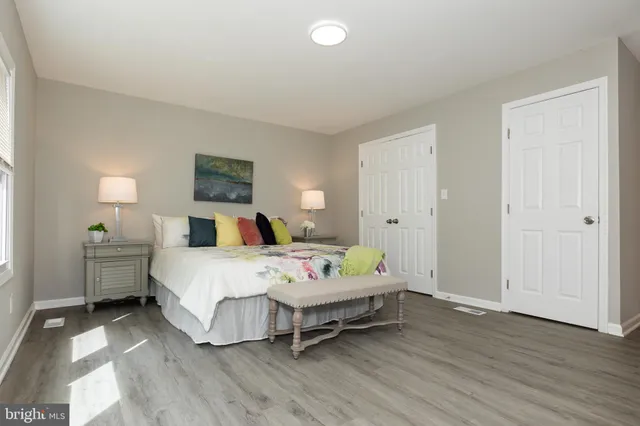 a bed room with bed and a window