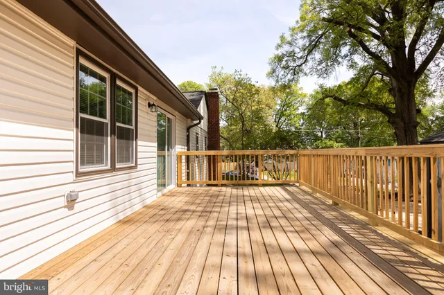 a view of a wooden chairs on a deck