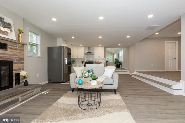 a view of a dining room with a table and chairs