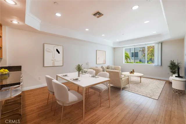a view of a dining room with furniture window and wooden floor