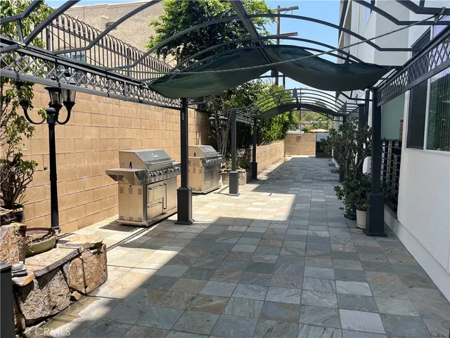 a view of a chairs and table in the patio