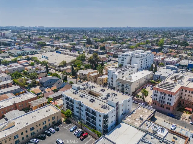 an aerial view of a city with lots of residential buildings