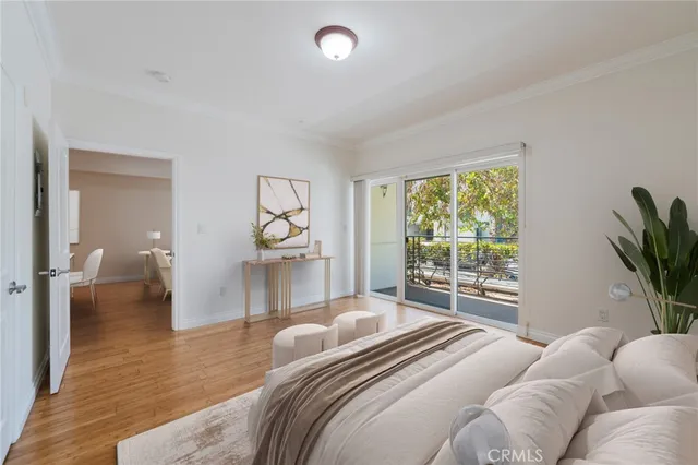 a bedroom with a large bed and a large window