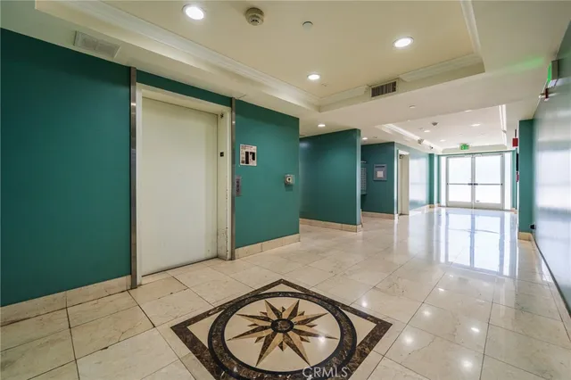 a view of a hallway with a chandelier