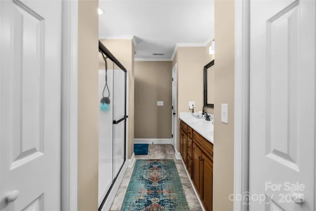 a en suite bathroom with a sink and a mirror