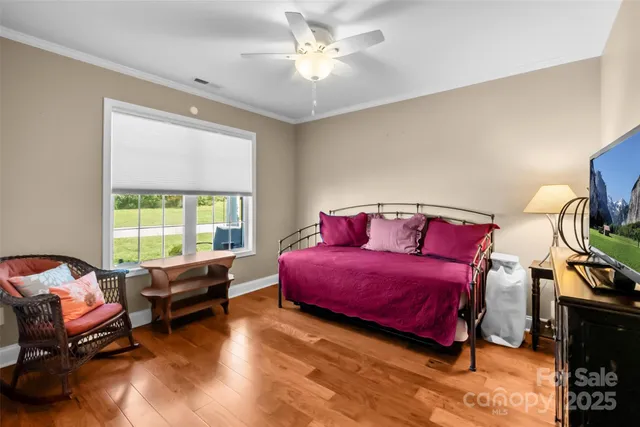 a bedroom with furniture and a window