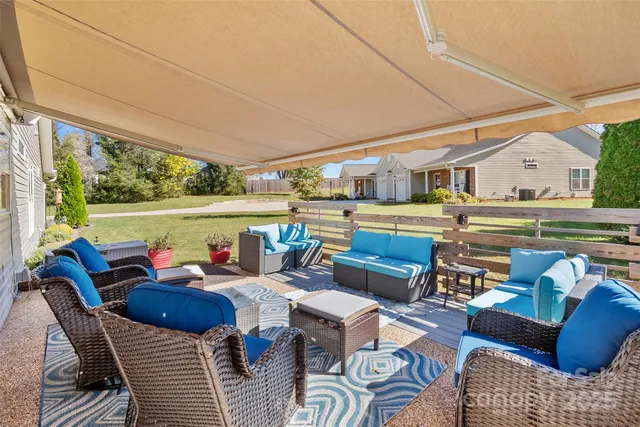 a view of a patio with couches chairs and a table