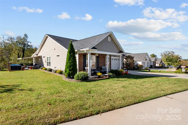 a view of a house with swimming pool and a yard