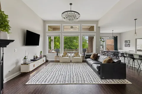 a living room with furniture fireplace and a flat screen tv