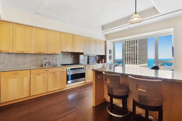 a kitchen with a sink cabinets and window