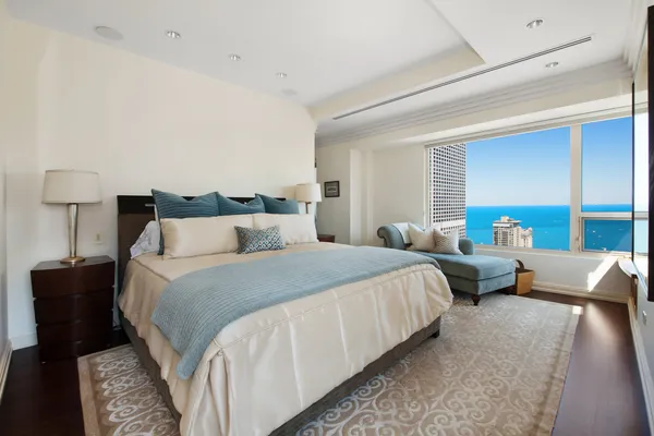a bedroom with bed and window