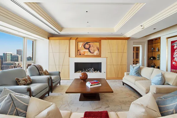 a living room with furniture and a fireplace