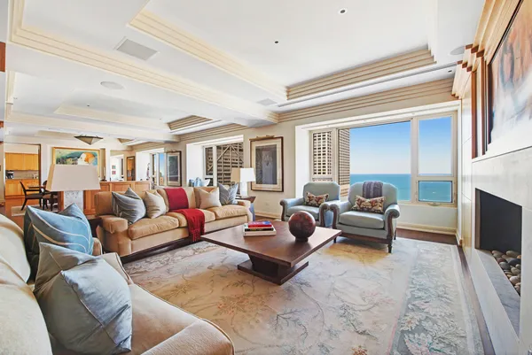 a living room with furniture fireplace and a flat screen tv