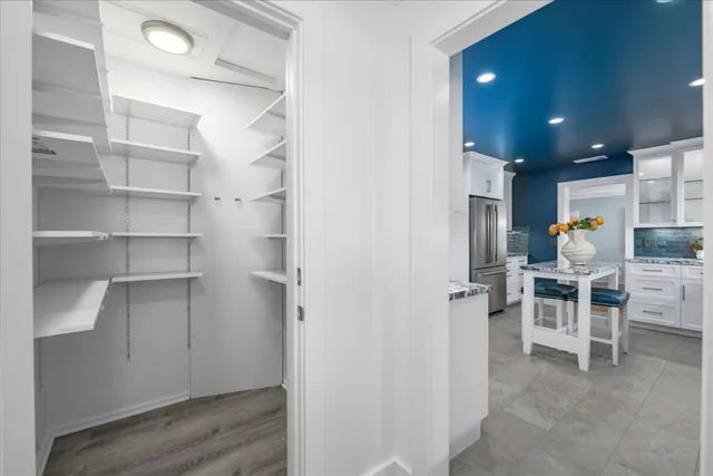 a view of kitchen with furniture and wooden floor