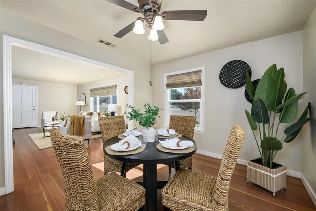 a view of a livingroom with furniture and a table
