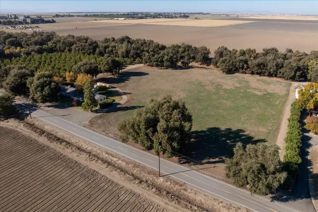 an aerial view of a house with a lake view